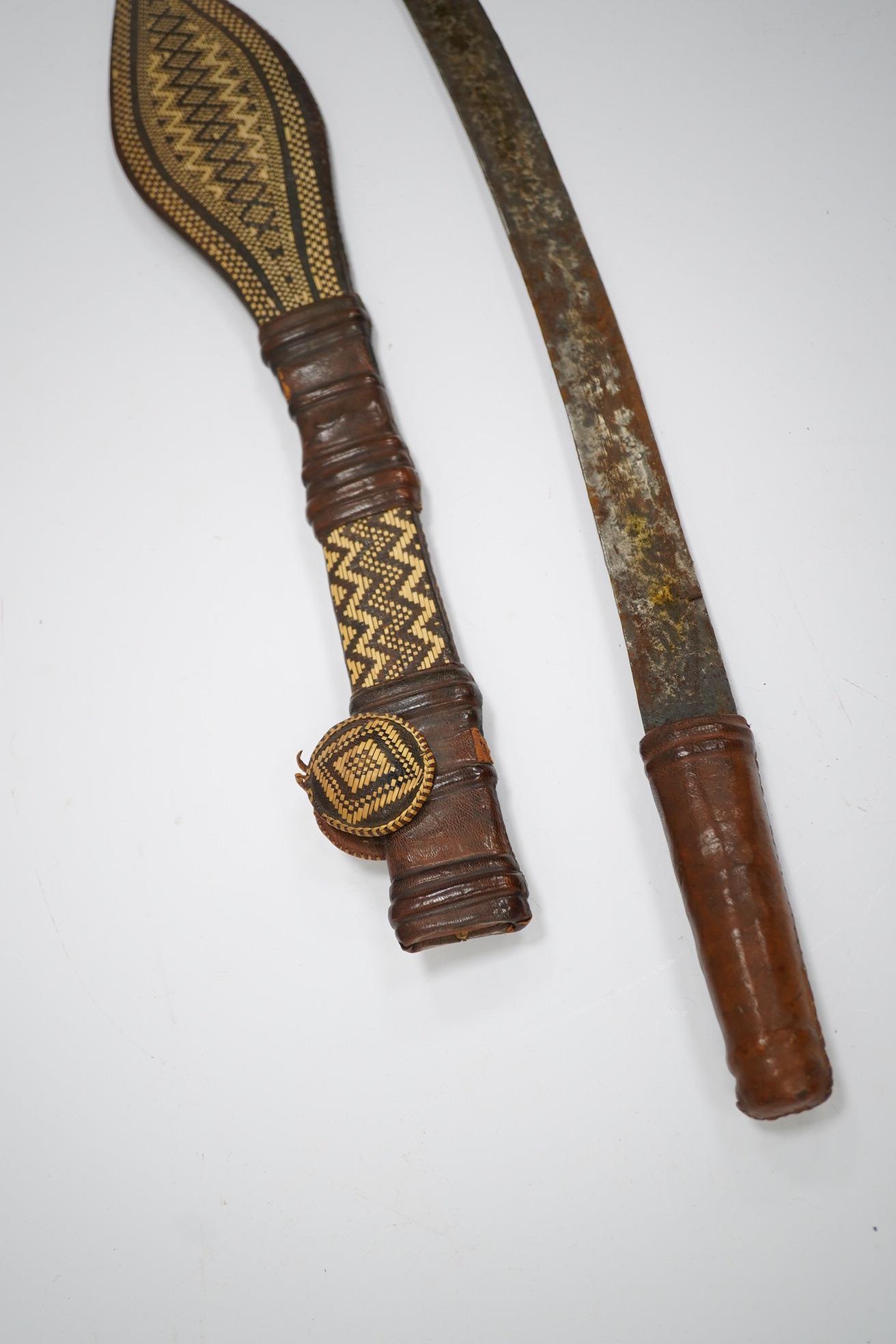 A group of African, Indonesian and other South East Asian carvings and a lacquer box. Sword 60cm long. Condition - poor, fair to good